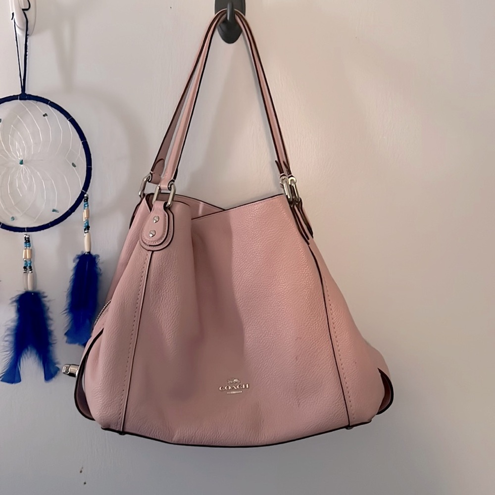 This is a pink coach tote bag